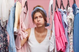 Person standing confidently in comfortable clothing, reflecting the connection between clothing and body image.